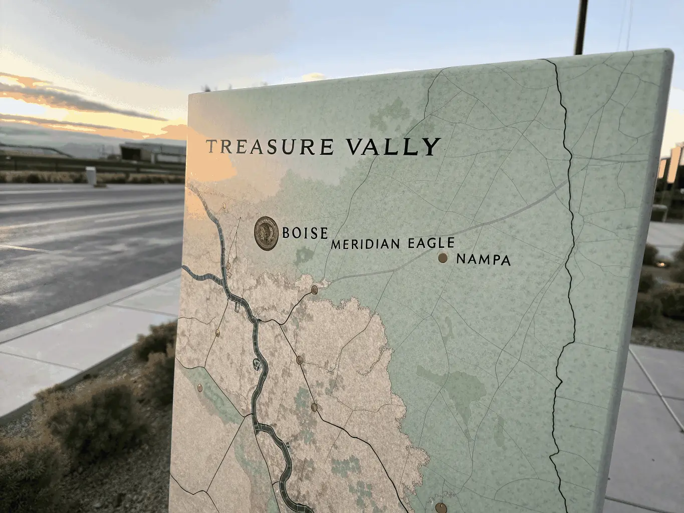 A modern, clean map illustration of the Treasure Valley region highlighting Caldwell, Boise, Meridian, Nampa, and Eagle, with clickable city markers and a blue-green color palette, used to visually represent the service coverage area for a plumbing company.